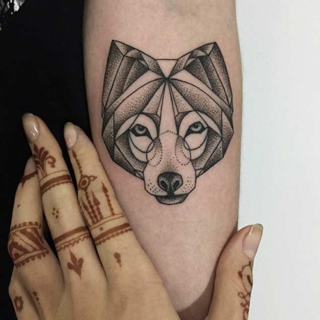 Vintage style black ink wolf tattoo on arm