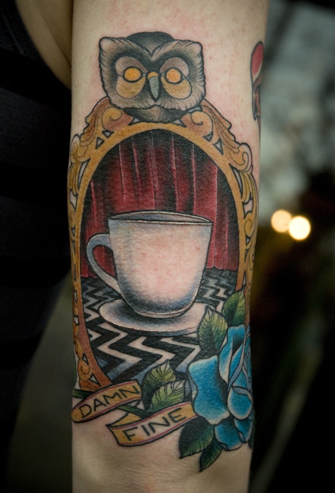 Vintage style colored arm tattoo of tea cup portrait with lettering and rose