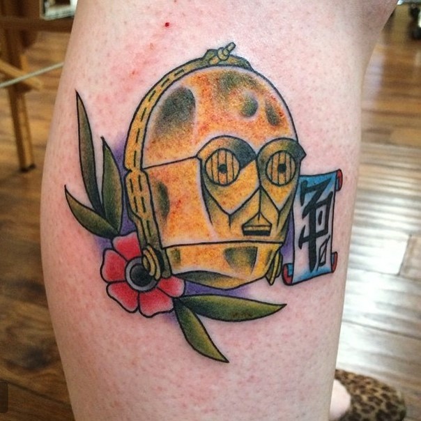 Vintage style colored C3PO portrait with flower tattoo on leg with fantasy lettering