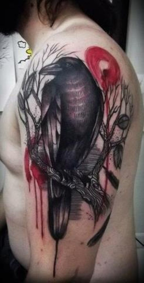 Vintage style colored dark crow tattoo on shoulder with blooming tree