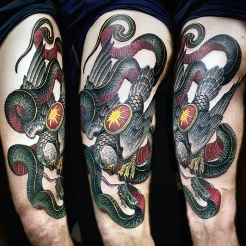 Vintage style colored eagle fight with snake tattoo on half sleeve