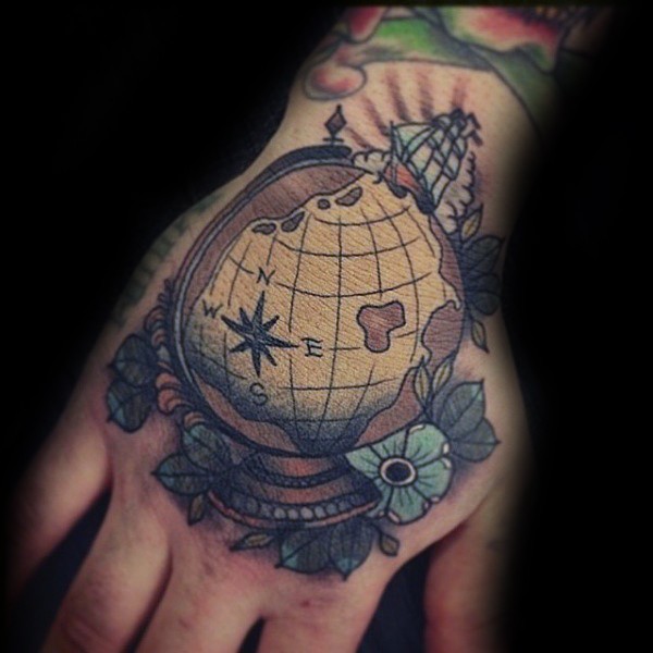 Vintage style colored hand tattoo of little globe with flowers