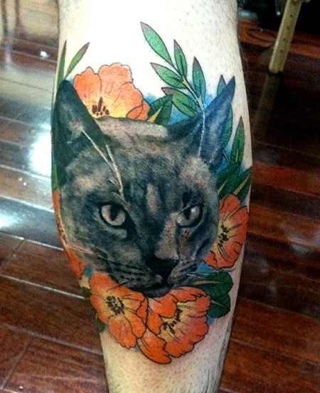 Vintage style colored leg tattoo of cat with nice flowers
