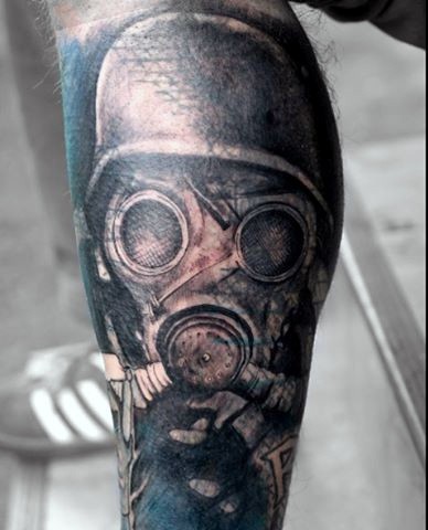 Vintage style colored leg tattoo of soldier in gas mask