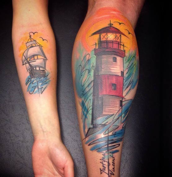 Vintage style colored light house tattoo with lettering combined with little forearm tattoo of colored sailing ship