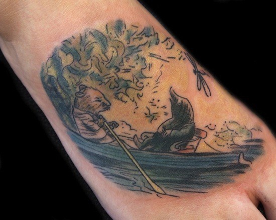 Vintage style colored picture of mouse in boat tattoo on foot
