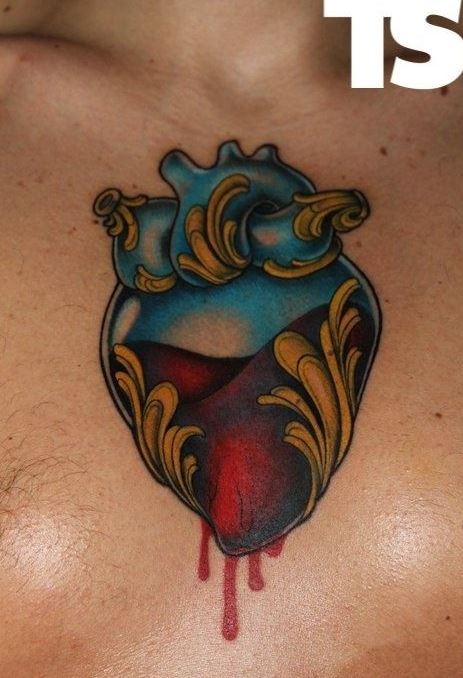 Vivid colors heart tattoo on chest