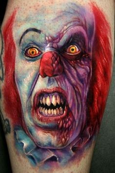Vivid colors spooky clown face tattoo