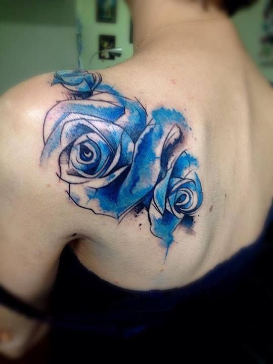 Watercolor blue roses tattoo on shoulder by victor octaviano