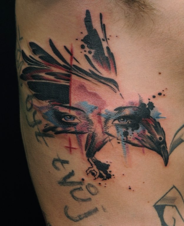 Watercolor face of woman and bird tattoo on ribs