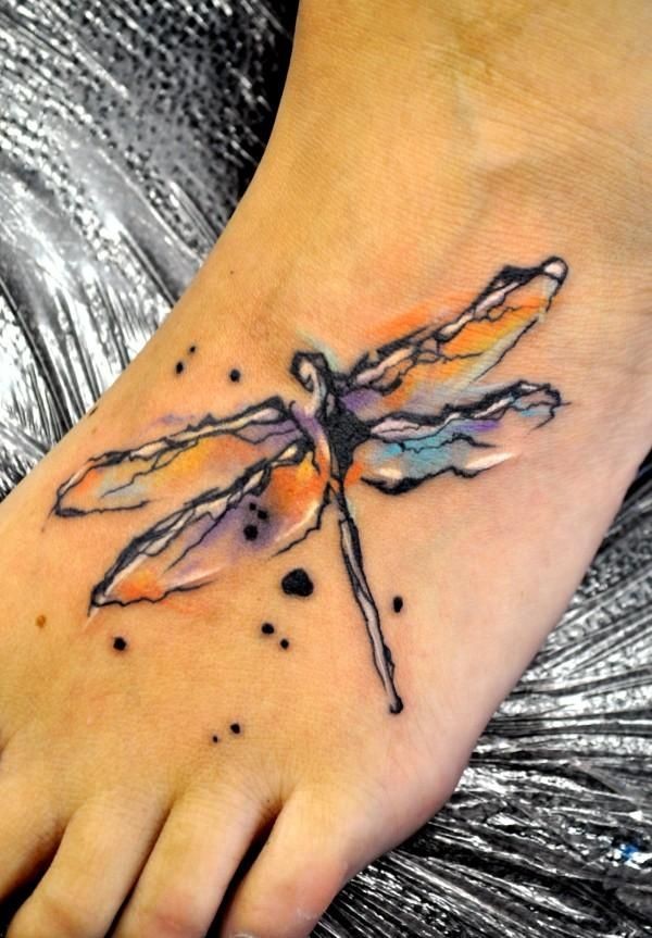 Watercolor dragonfly tattoo on leg