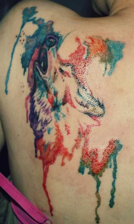 Watercolor howling wolf tattoo