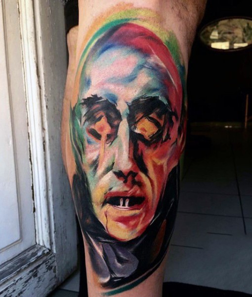 acquerello astratto faccia di vampiro tatuaggio su gamba