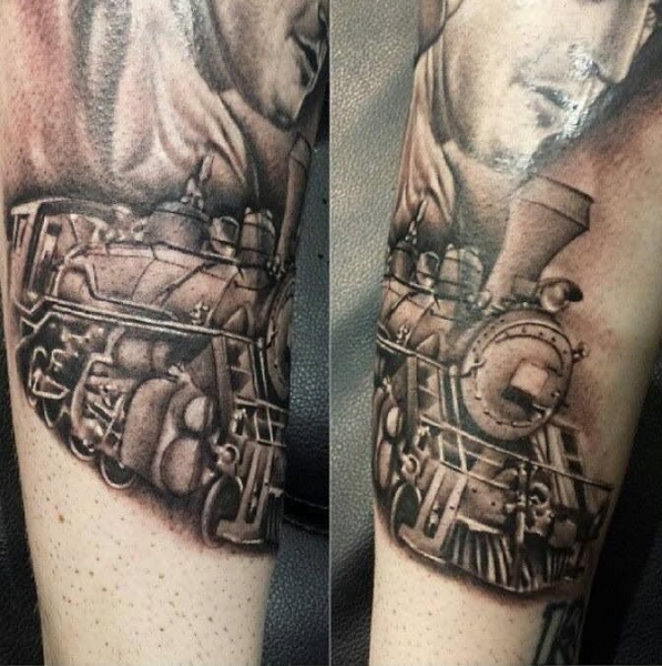 Watercolor like colored train tattoo on arm