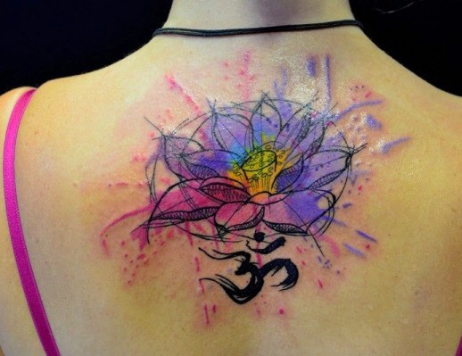 Watercolor lotus with mantra om tattoo on back