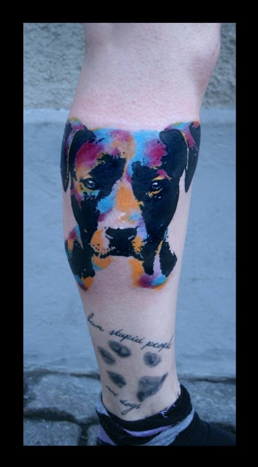 Watercolor portrait of a dog and paw print tattoo