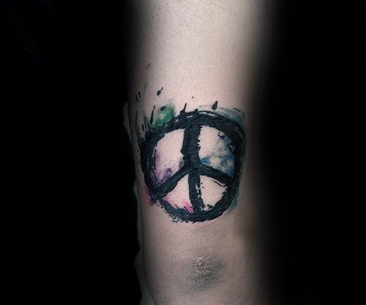 Watercolor style arm tattoo of pacific symbol