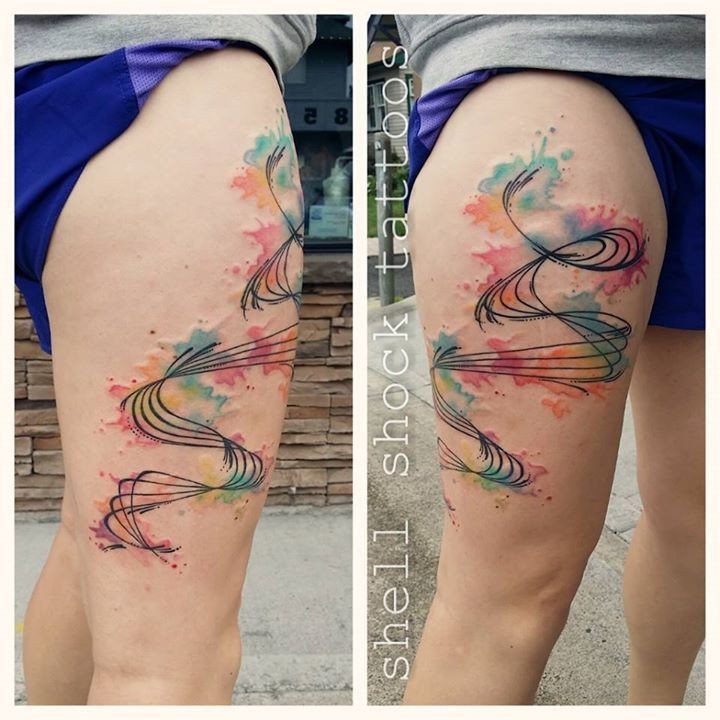 Watercolor style big abstract thigh tattoo of various lines