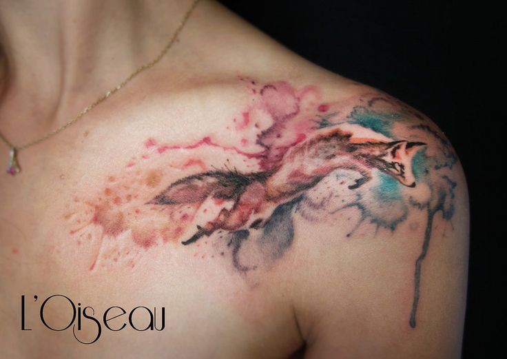 Watercolor style colored shoulder tattoo of jumping fox