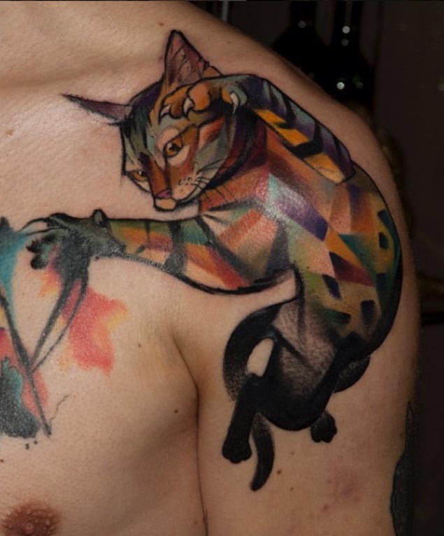 Watercolor style colored shoulder tattoo of big cat