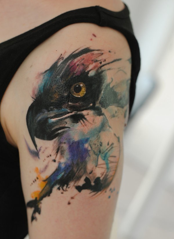 Watercolor style colored shoulder tattoo of eagle head