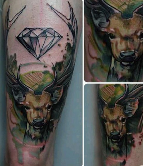 Watercolor style colored thigh tattoo of deer with big diamond