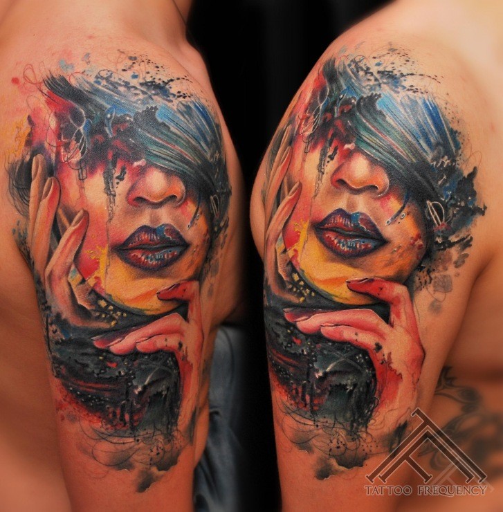 Watercolor style colorful shoulder tattoo of woman portrait