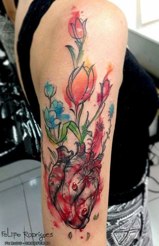 Watercolor style detailed shoulder tattoo of breathtaking flowers with human heart