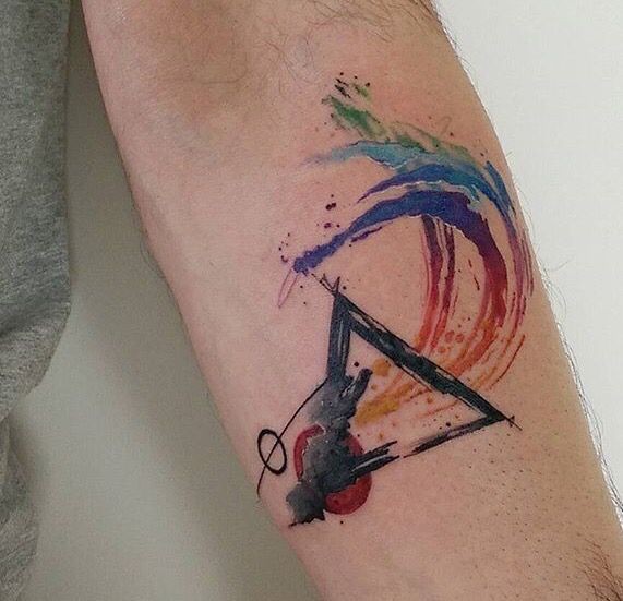 Watercolor style forearm tattoo of triangle and circle