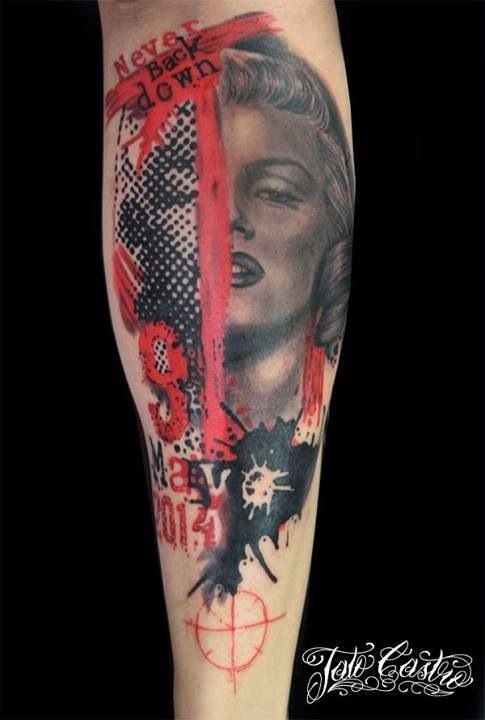 Watercolor style impressive looking forearm tattoo of Merlin Monroe face with lettering