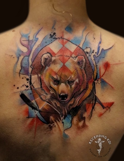 Watercolor style interesting looking back tattoo of big bear
