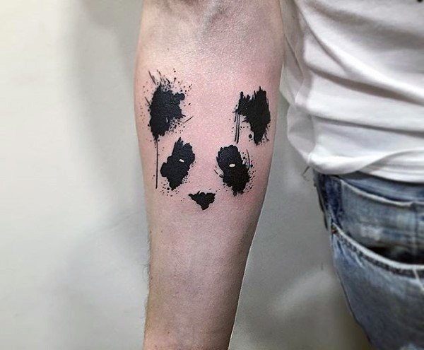 Watercolor style interesting looking forearm tattoo of panda bear face