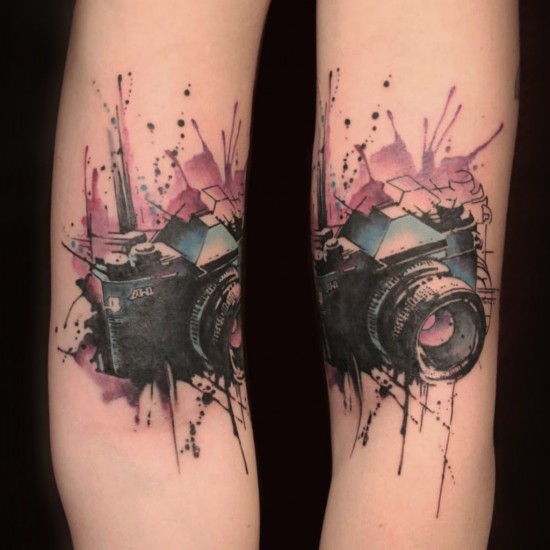 Watercolor style magnificent looking colored arm tattoo of old camera
