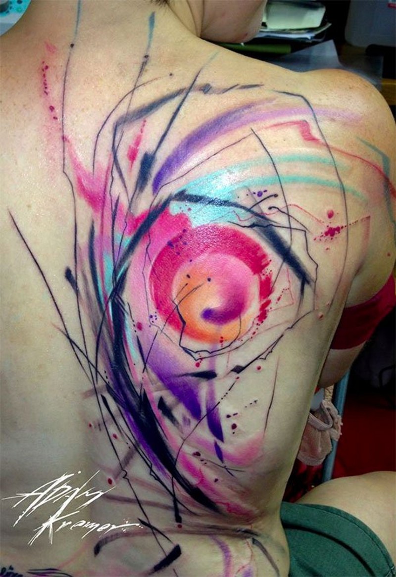 Watercolor style painted multicolored tattoo on shoulder