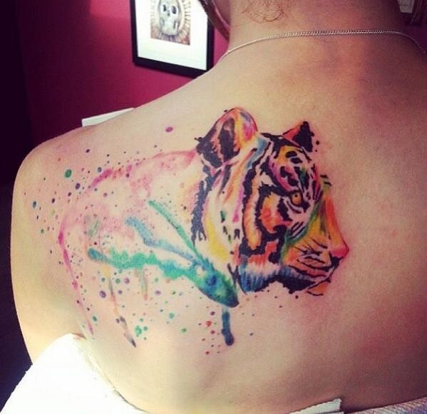 Watercolor tattoo of tiger profile on back
