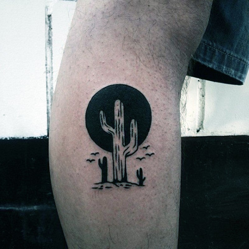 Western style black and white cactus tattoo on leg