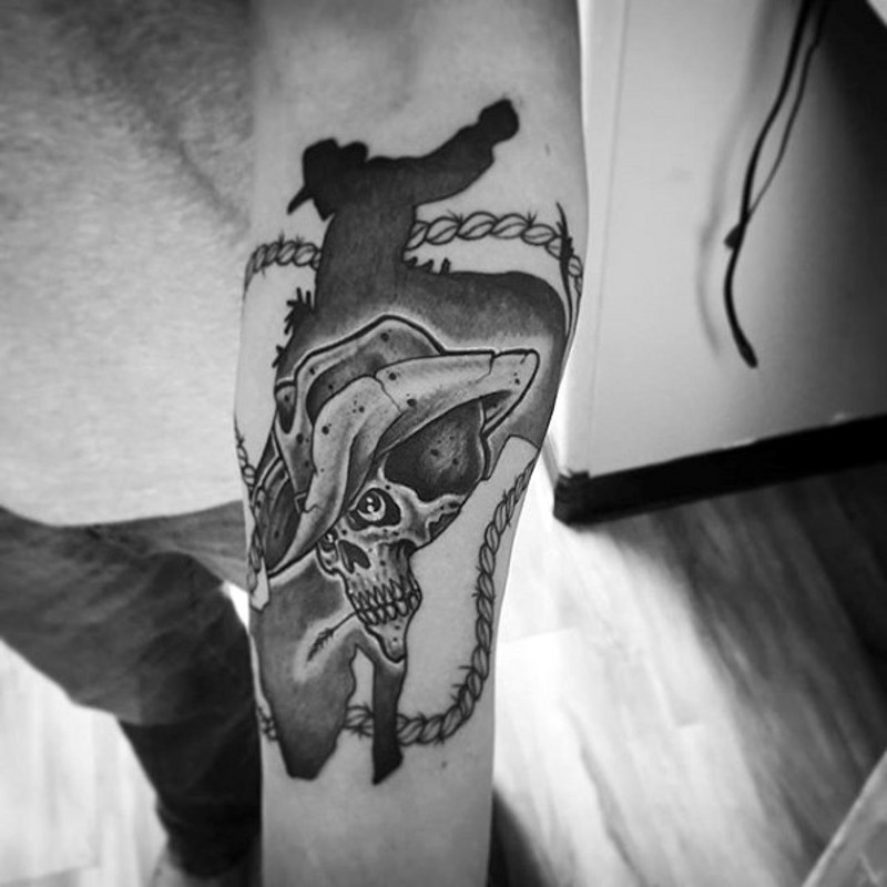 Western style black and white cowboy skull tattoo on arm
