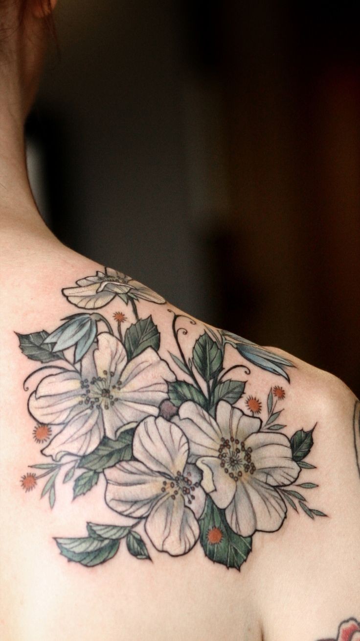White bells flowers tattoo on shoulder