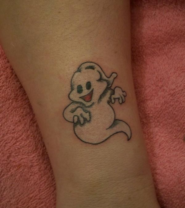 White ink cartoon ghost tattoo on skin