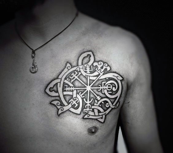 White ink colored chest tattoo of Celtic ornaments