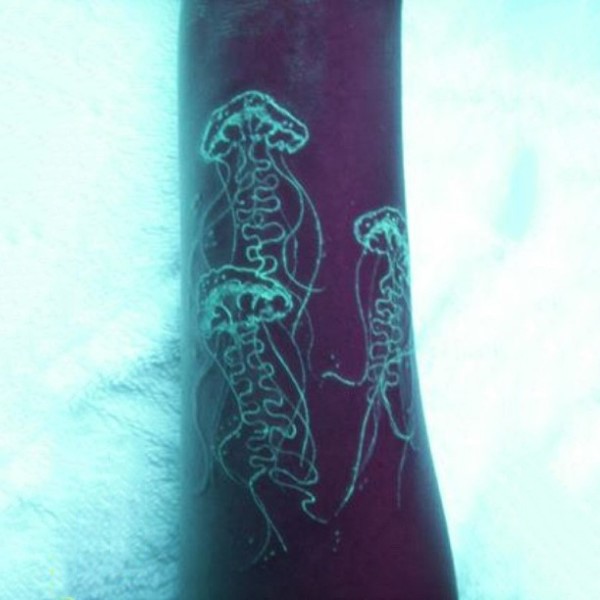 White ink original luminescence jellyfishes tattoo