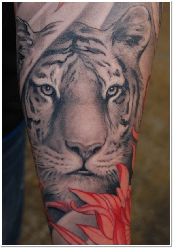 White tiger head with red flower tattoo on arm