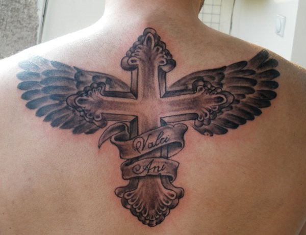 Winged cross memorial tattoo on back