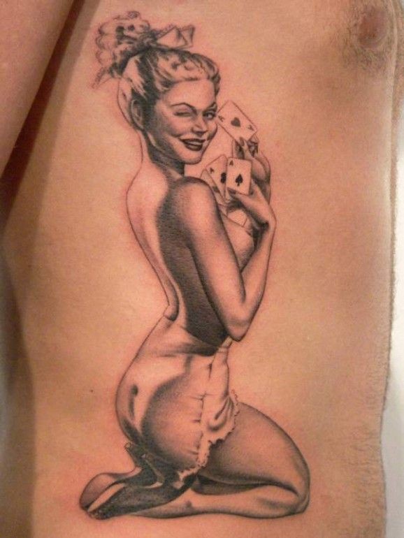 Winking girl with cards pin up tattoo by Xavier Garcia