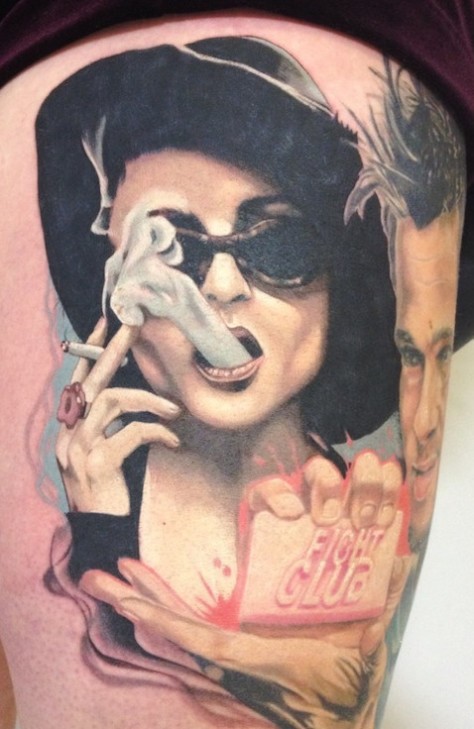 Woman in black hat with a cigarette thigh tattoo for women by Tony Sklepic