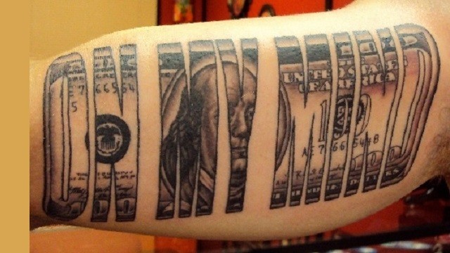 Wonderful black and white arm tattoo of lettering shaped dollar bill