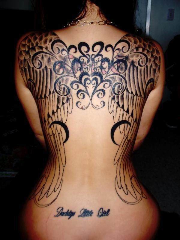 Wonderful black wings tattoo on back for women