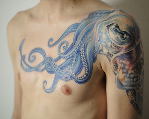 Wonderful blue octopus tattoo on shoulder and chest
