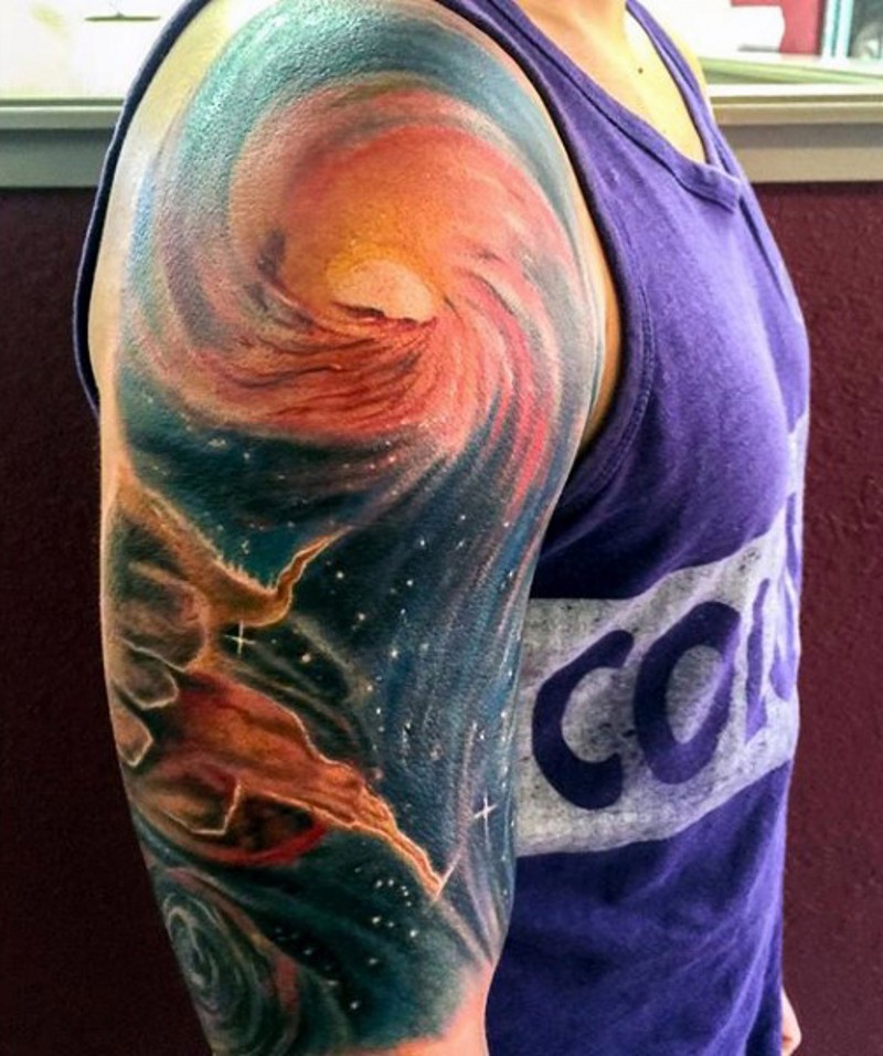 Wonderful colored deep space half sleeve area tattoo