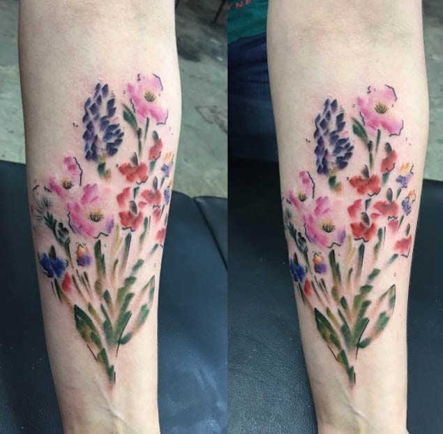 Wonderful colored medium size forearm tattoo of wildflowers